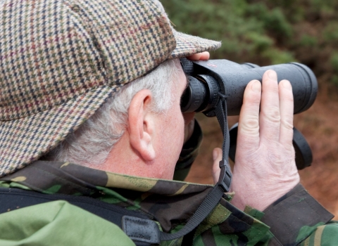 a man with binoculars