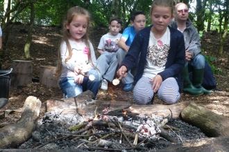 Toasting marshmallows at a Forest School