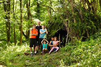 The whole family making a den in the woods