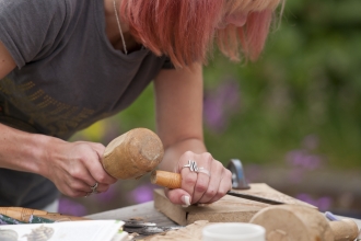 woman carving wood