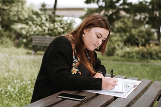 Young woman writing 