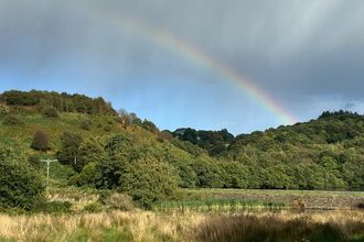 Styperson pool in Adlington with a rainbow over the top