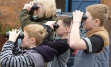 Children with binoculars c. Claire Huxley