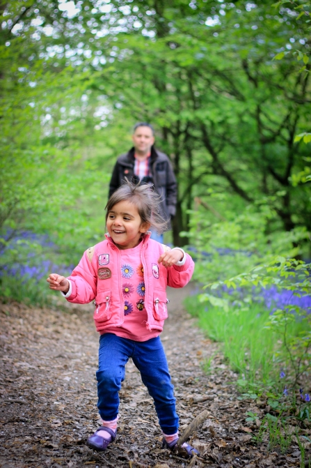 Child running through the forest