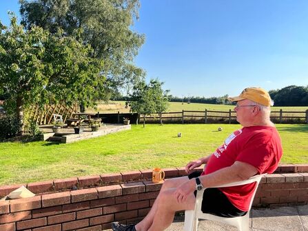 Legacy donor David Aldred relaxing in his garden