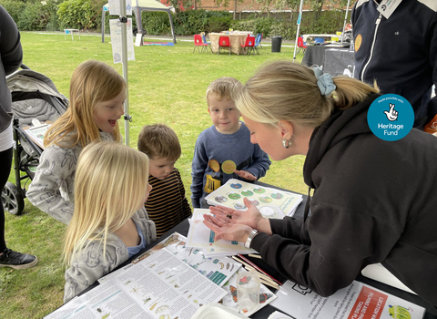 Eve showing kids a dragonfly 2